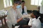 Dr TT and Dr Shanta doing dental screenings